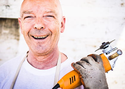 man holding brown angle grinder thumbnail