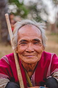 man holding wooden stick thumbnail