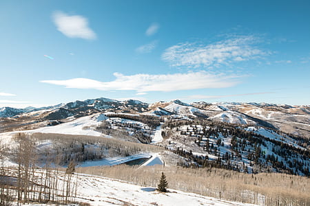 brown mountains covered with snow thumbnail