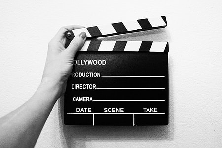 gray-scale photo of person holding director's cut board thumbnail