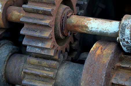 closeup photo of brown and white machine gears thumbnail