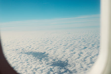 view of clouds from flying airplane thumbnail