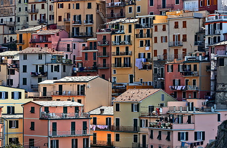 cityscape photography of assorted-color high-rise buildings thumbnail