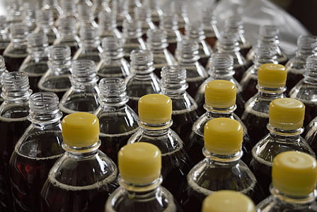 bottles filled with maroon liquids thumbnail