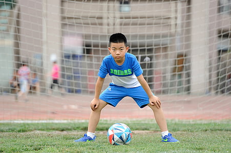 boy guarding soccer goal thumbnail