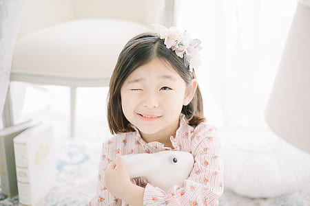 girl wearing pink floral long-sleeved top inside the room thumbnail