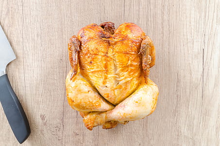 roasted chicken on brown wooden surface thumbnail