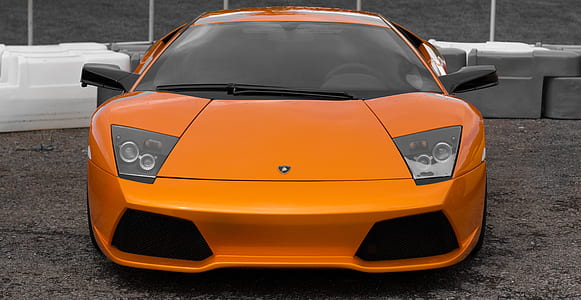 orange Lamborghini Gallardo on road thumbnail