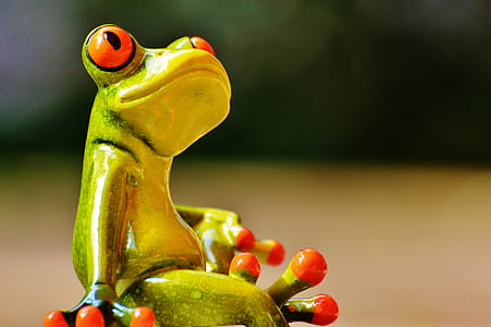 closeup photography of green and yellow ceramic figurine thumbnail