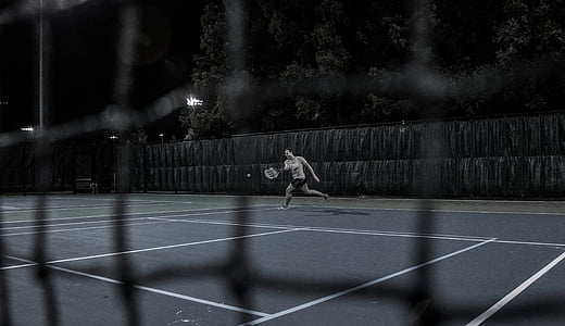 person playing tennis outdoors thumbnail