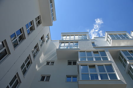 low angle photography of white concrete building thumbnail