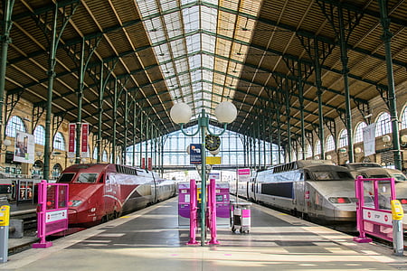 two white and red trains in train station thumbnail