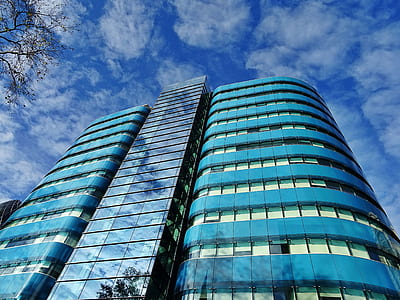 Low Angle Photography of Blue Tinted Glass Buildings thumbnail