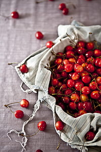 selective photo of bundle of red cherries thumbnail