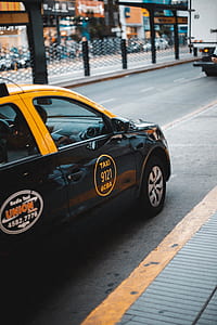 black taxi 9121 on concrete road thumbnail