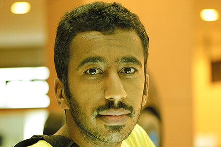 smiling man in yellow top thumbnail