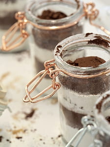 half filled airtight jar on white surface thumbnail
