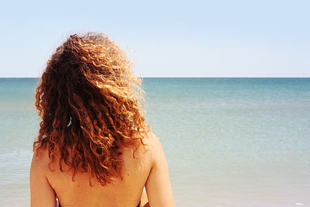 topless woman in front on sea at daytime thumbnail