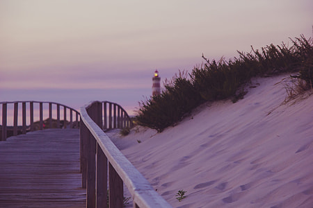 lighthouse during nighttime thumbnail