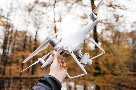 person holding DJI Phantom 4 thumbnail