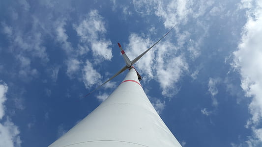 low angle photography of white and red wind mill at daytime thumbnail