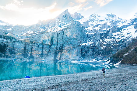 person standing on sea shore thumbnail