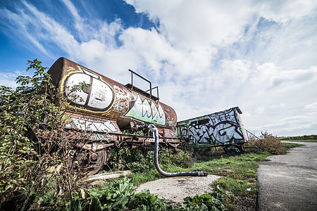 Rusted Wagon with Grafitti Art Alone in The Field thumbnail