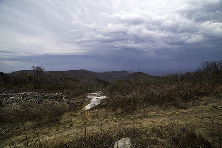 Mountains in the distance in the landscape under rain clouds at Sassafras Mountain thumbnail