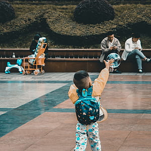 boy reaching bubble outdoor thumbnail