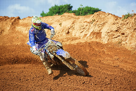 man riding motocross dirt bike thumbnail