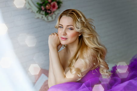 brown haired woman in purple dress thumbnail