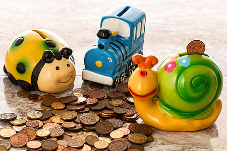 three assorted plastic coin banks thumbnail