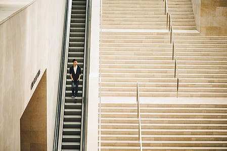 man standing on staircase thumbnail