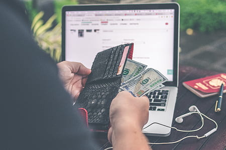 person holding banknotes thumbnail