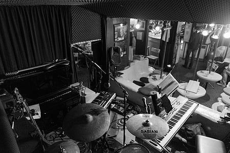 grayscale photo of drum set in music room thumbnail