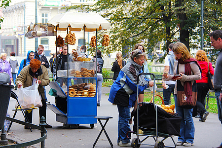 people standing on street buying food thumbnail
