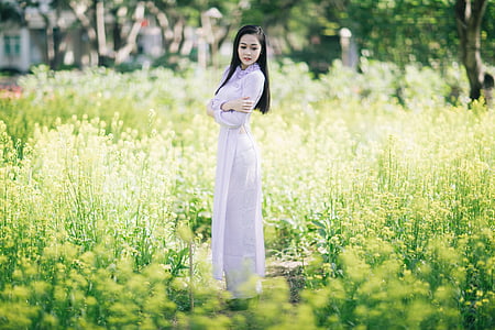 woman wearing white dress surrounded yellow petal flower thumbnail