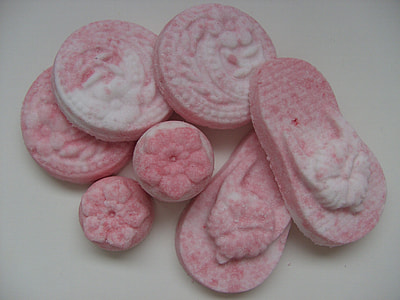 pink round and pink flip-flop soaps on white surface thumbnail