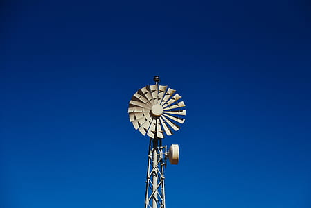 white water mill under blue sky thumbnail