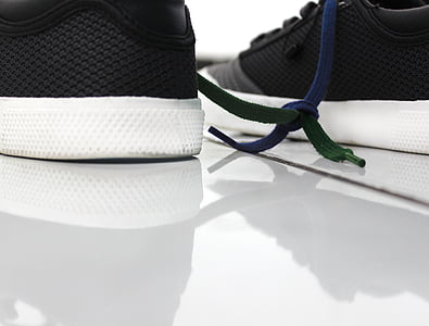 pair of black-and-white sneakers on white surface thumbnail