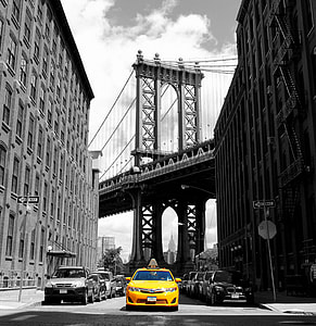 selective color of yellow car between buildings thumbnail