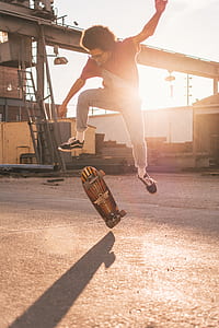 man doing skateboard tricks on concrete flooring thumbnail