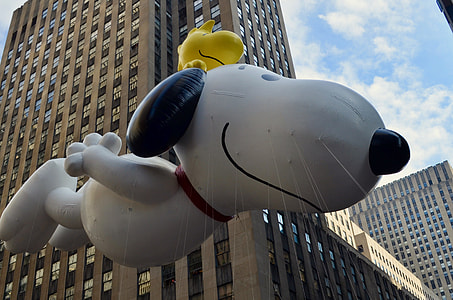 Snoopy inflatable airblown under high-rise building thumbnail
