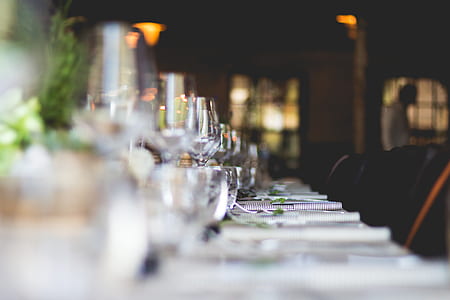 selective focus photography of wine glasses table arrangement thumbnail
