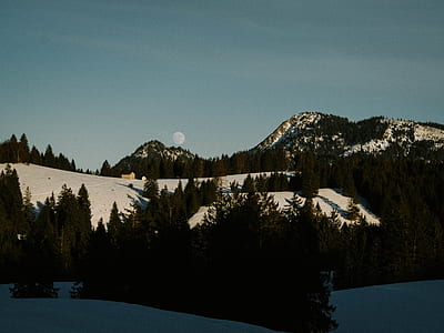 black mountain covered with snow thumbnail