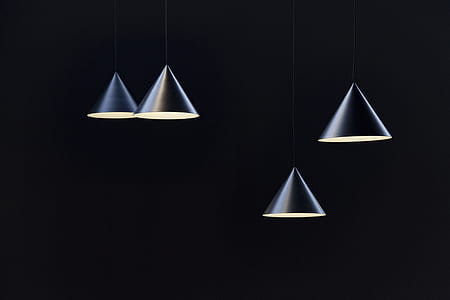 four gray metal pendant lamps inside dimmed room thumbnail