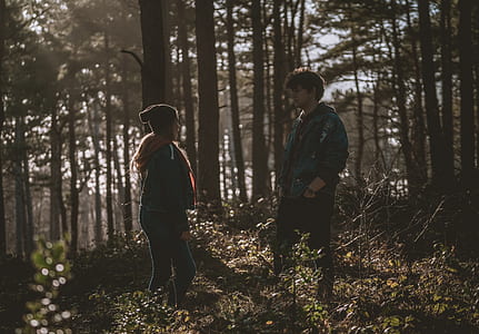 man and woman in the middle of the forest thumbnail