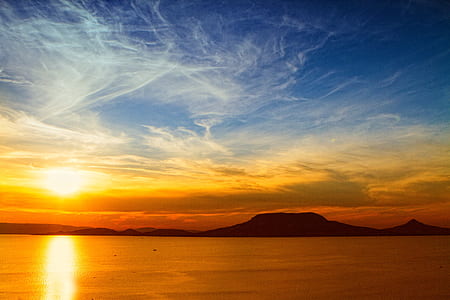 landscape photography of calm waters during golden hour thumbnail