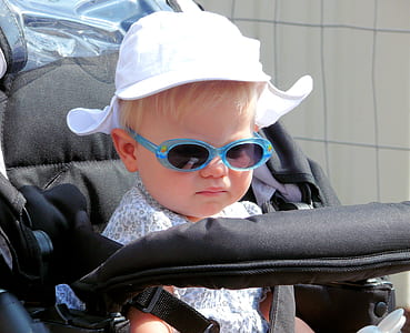 baby in stroller during daytime thumbnail