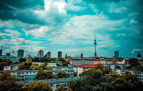 high rise building under white clouds at daytime thumbnail